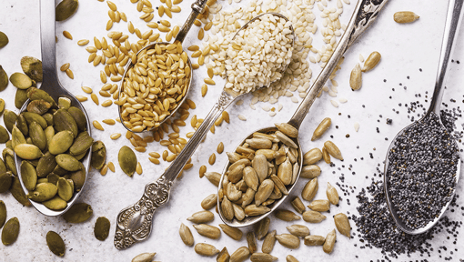 Different types of seeds in different spoons