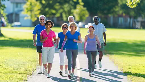 A group of adults enjoying an outdoor interval walking workout