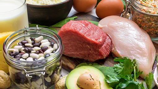 Foods that provide vitamin support including carrots, leafy greens, eggs, and avocado