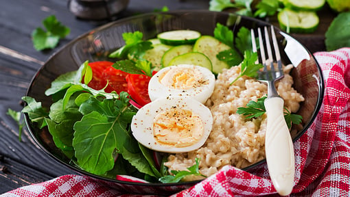 Nutrition_Salad, egg and oatmeal on bowl