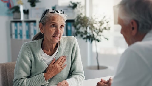 Older woman speaking with a healthcare professional 